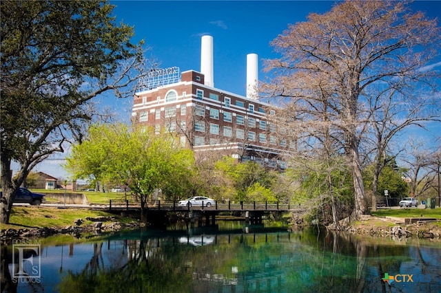 view of building exterior featuring a water view