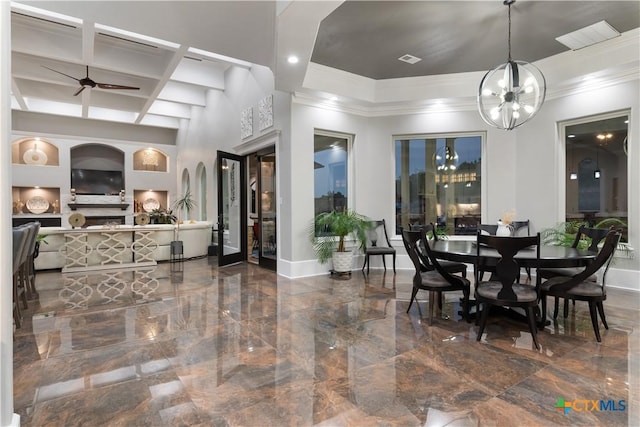 dining room featuring visible vents, crown molding, baseboards, and a notable chandelier