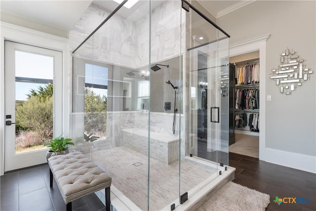 full bath featuring baseboards, a shower stall, and crown molding