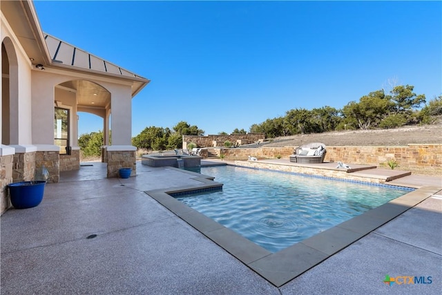 pool featuring a patio