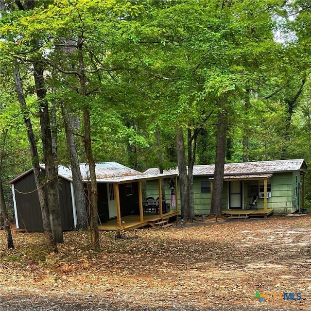 single story home with a wooden deck