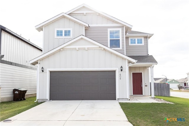 view of front of house featuring a front yard and a garage