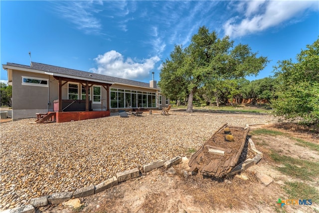 rear view of property featuring a patio