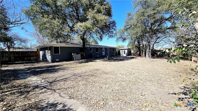 back of house with fence