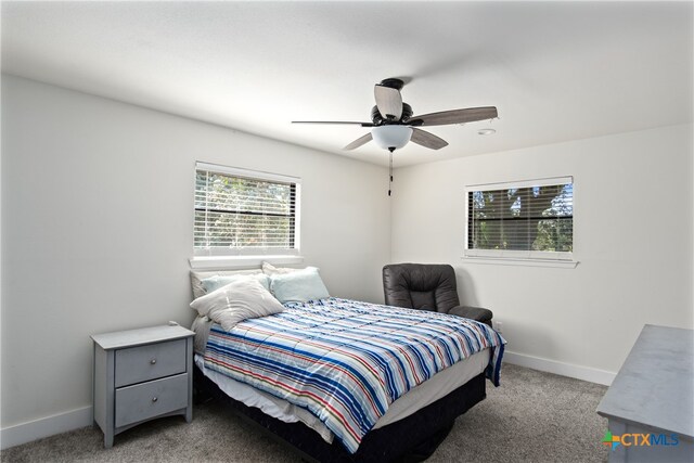 bedroom with light carpet and ceiling fan