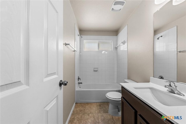 bathroom with shower / bathtub combination, vanity, toilet, tile patterned floors, and baseboards