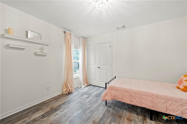 1110 Twin Deer Ln, Canyon Lake, TX 78133 - bedroom with wood finished floors and baseboards