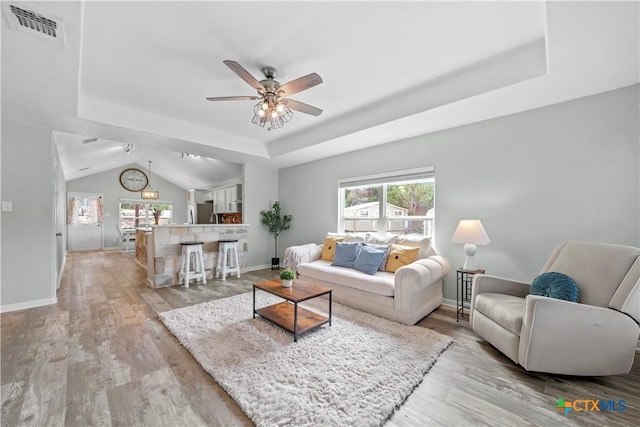 1110 Twin Deer Ln, Canyon Lake, TX 78133 - living room with a tray ceiling, a ceiling fan, and light wood-style floors