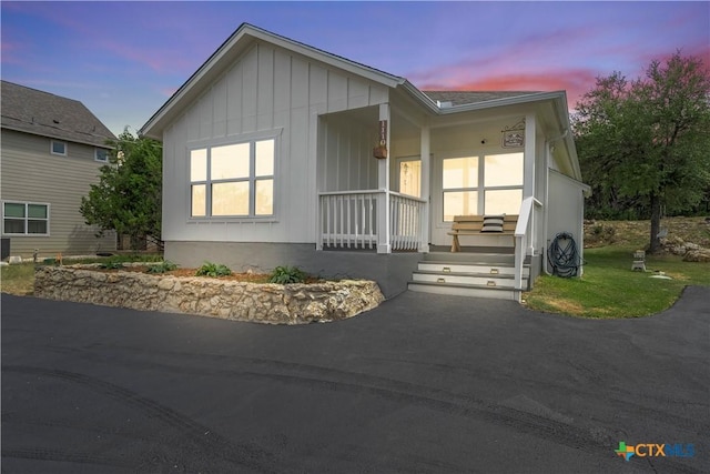 1110 Twin Deer Ln, Canyon Lake, TX 78133 - view of front of house with covered porch and board and batten siding