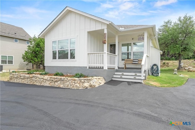 1110 Twin Deer Ln, Canyon Lake, TX 78133 - view of front of home with covered porch and board and batten siding