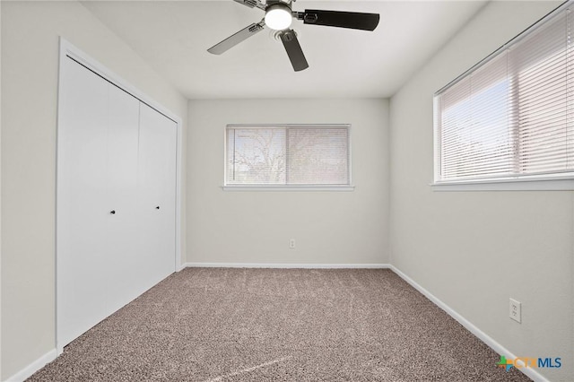 unfurnished bedroom featuring a closet, ceiling fan, and carpet