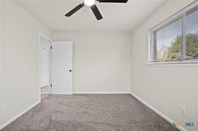 unfurnished room featuring carpet floors and ceiling fan