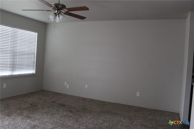 carpeted empty room with ceiling fan