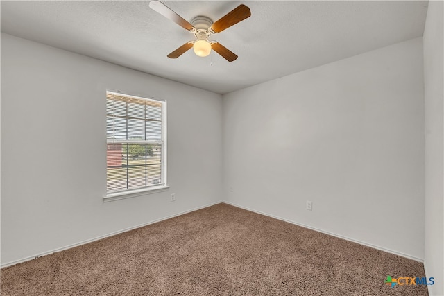 carpeted empty room with ceiling fan