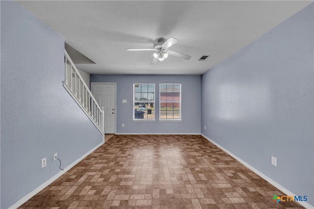 unfurnished living room featuring ceiling fan