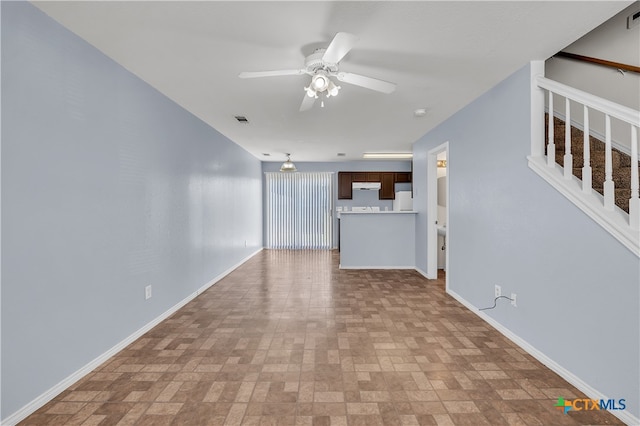 unfurnished living room featuring ceiling fan