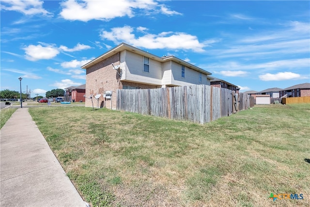 view of property exterior featuring a yard