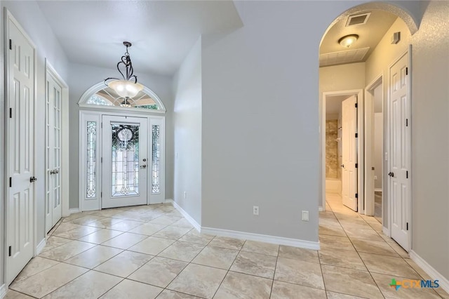 503 Wilderness Way, New Braunfels, TX 78132 - entrance foyer with light tile patterned flooring and arched walkways