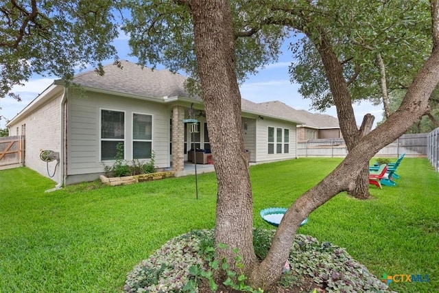 1330 Logan Blvd, Salado, TX 76571 - back of property featuring a fenced backyard and brick siding