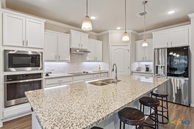 1330 Logan Blvd, Salado, TX 76571 - kitchen featuring stainless steel appliances, ornamental molding, white cabinets, dark wood-style floors, and recessed lighting