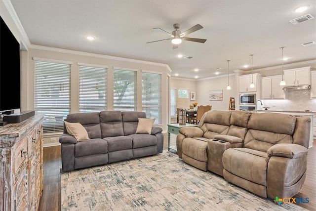 1330 Logan Blvd, Salado, TX 76571 - living room with ceiling fan, ornamental molding, light wood-style flooring, and recessed lighting