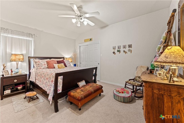 bedroom featuring baseboards, a ceiling fan, and carpet flooring