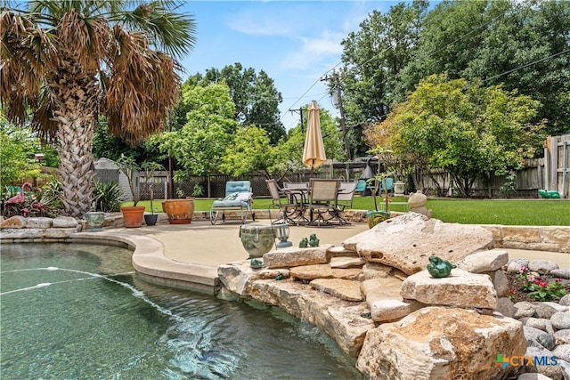 view of home's community with a patio and a fenced backyard