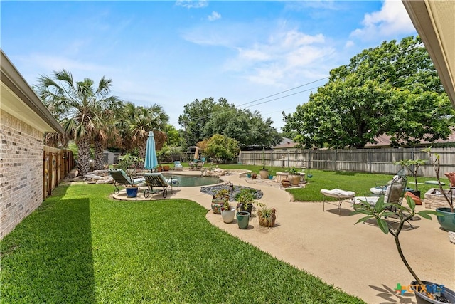 view of yard featuring a fenced in pool, a patio area, and a fenced backyard