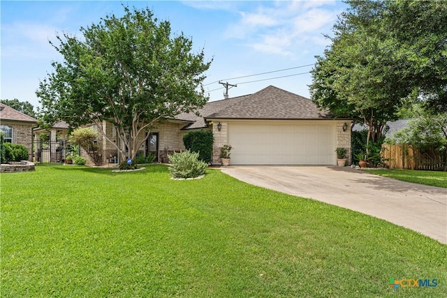 single story home featuring stone siding, a front lawn, concrete driveway, and fence