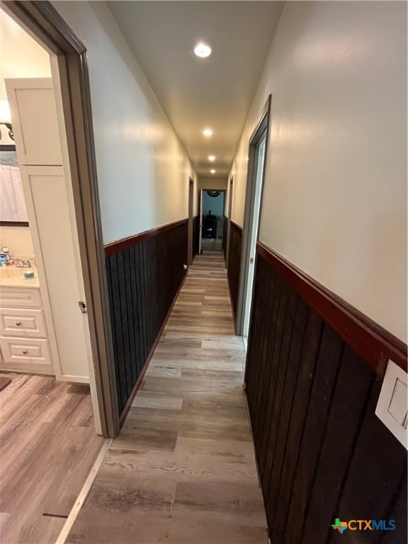 hallway featuring light hardwood / wood-style flooring