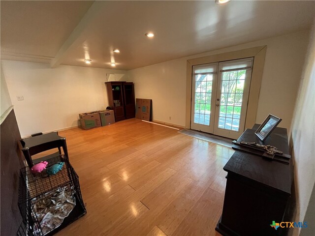 living room featuring french doors and wood-type flooring