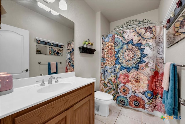 full bathroom featuring a shower with curtain, toilet, vanity, and tile patterned flooring