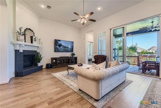 108 Rainbow Valley Trl, San Marcos, TX 78666 - living area featuring ceiling fan, light wood-style flooring, recessed lighting, and a fireplace