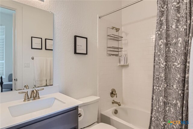 108 Rainbow Valley Trl, San Marcos, TX 78666 - full bath featuring shower / tub combo, toilet, vanity, and a textured wall