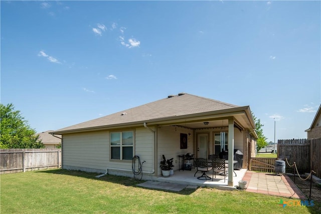 rear view of property with a patio area and central air condition unit
