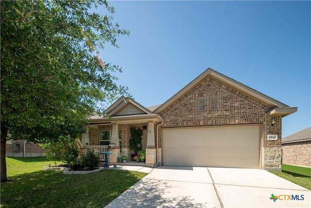ranch-style home with brick siding, a garage, concrete driveway, and a front lawn