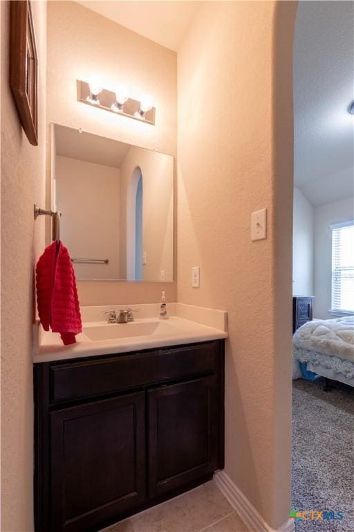 bathroom featuring vanity and baseboards