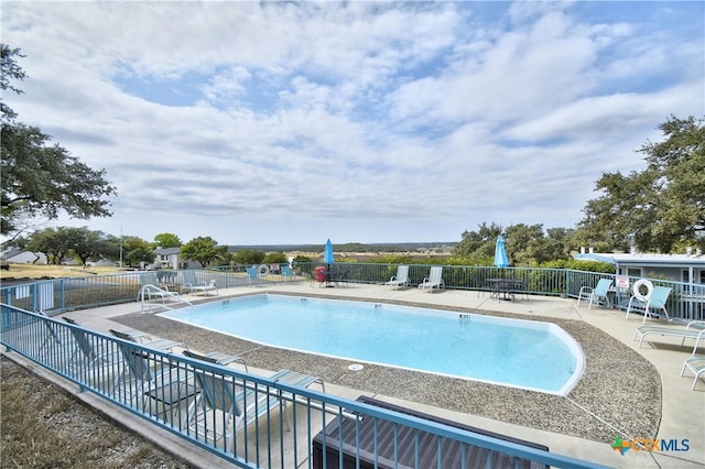 view of pool with a patio area