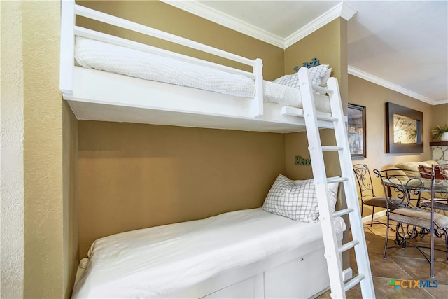 tiled bedroom featuring crown molding