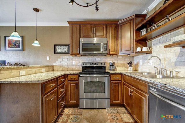 kitchen featuring sink, appliances with stainless steel finishes, ornamental molding, backsplash, and pendant lighting