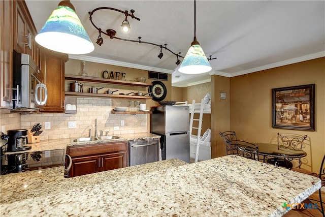 kitchen with light stone counters, crown molding, stainless steel appliances, backsplash, and sink