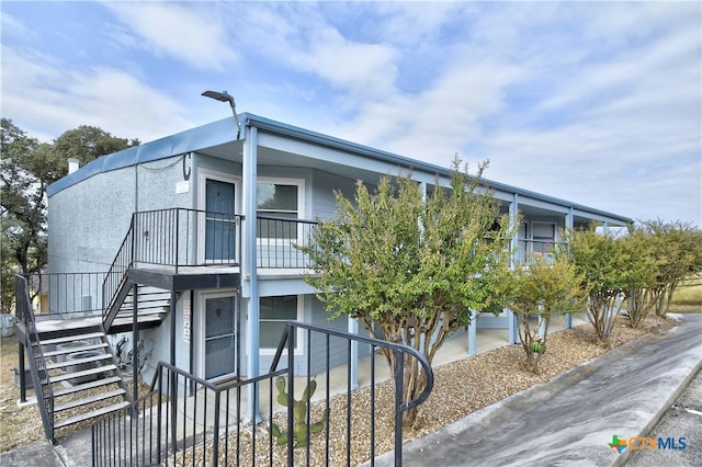 view of property exterior with a balcony