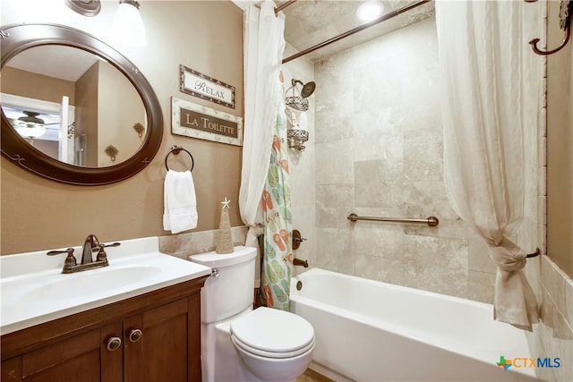 full bathroom with vanity, toilet, and shower / tub combo