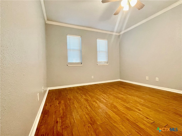 spare room with wood-type flooring, ceiling fan, and crown molding