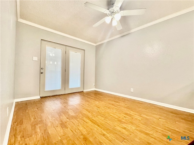 unfurnished room with hardwood / wood-style floors, ceiling fan, a textured ceiling, and crown molding