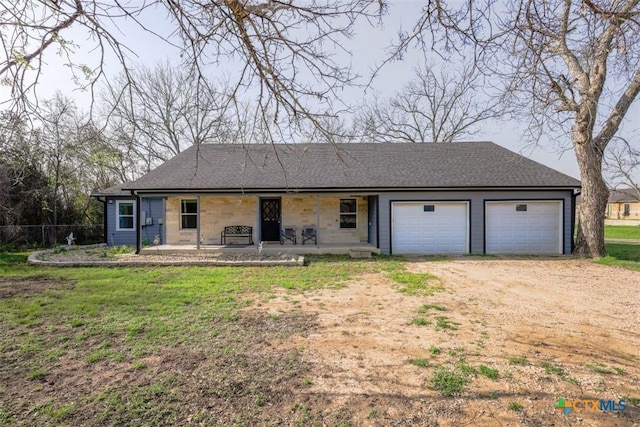 single story home featuring a garage, fence, a porch, and dirt driveway