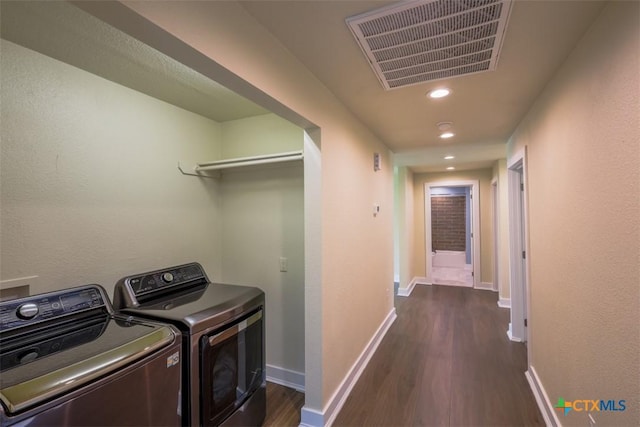 washroom featuring recessed lighting, dark wood-style flooring, washer and clothes dryer, laundry area, and visible vents