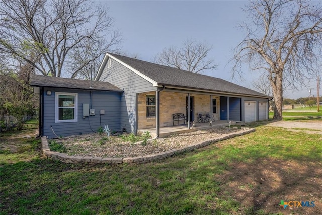 ranch-style home with a porch, concrete driveway, a front lawn, and an attached garage
