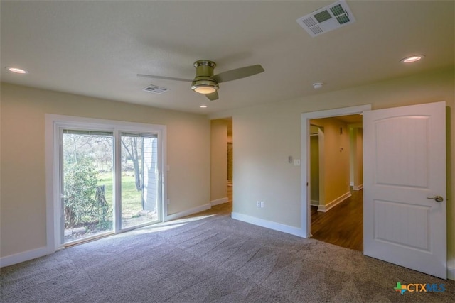 carpeted empty room with visible vents, ceiling fan, recessed lighting, and baseboards