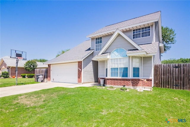 traditional-style home with a shingled roof, fence, concrete driveway, brick siding, and a front lawn